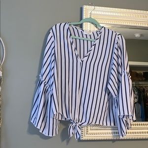 Navy blue and white bell sleeved blouse